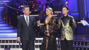 In Season 9, Kym Johnson and Donny Osmond danced three dances during the semi-finals in week 9.  Maybe Kym felt all three dances would keep her pretty warm and she needed a costume that gave her a chance to breathe.  We're not sure.  We notice Donny's not trying to look to closely at her while Tom interviews Kym.   