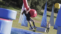 "At Full Tilt" - Episdoe 423  "'Wipeout'... the best thing to happen to gravity  since Isaac Newton," says host John Henson.  Human Pinball is in full  effect on the "Wipeout" course, as contestants are hit with life-size  flippers on the Qualifier. The Mood Swing is tipsy, as usual, and the  Wipeout Kitchen is serving up some Mexican food as a finale fiesta on  the Qualifier. Contestants are pared down to six on the Scareousel,  leaving only three to move on from the Super Tramp to vie for $50,000 in  the Wipeout Zone. Hosted by John Anderson (ESPN's "SportsCenter"), John  Henson (E! Entertainment's "Talk Soup") and co-hosted by Jill Wagner,  "Wipeout" airs THURSDAY, JUNE 30 (8:00-9:00 p.m., ET) on the ABC  Television Network. Photography by: Mike Weaver