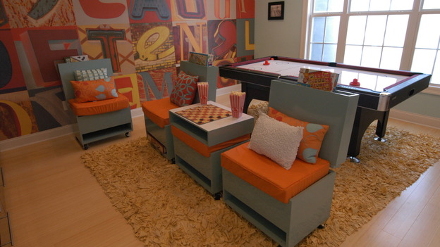 Eduardo's Game ChairsMaterials:- 2 sheets 3/4"x49"x97"- 10' of 1"x1" square steel- 10" of 1/4"x4" flat steel stock- 2 door hinges 3 1/2"- Flat head bolts for hinges- 4 2" casters with hardware- 18" x 18" upholstered cushionTools Needed:-  Table saw -  Chop saw-  Nail gun-  Drill-  Metal cutting saw-  WelderProcedure    The chair units are made up of three main parts.  The bottom seat section, the moveable top, and the hinge bracket.  The width and depth of the chair are determined by the size of the cushion.  The height is 16" to the top of cushion.  Lay out the chair and also find a comfortable angle for the chair back to sit at when it is lifted.  The seat back is same width and depth of chair and 4" tall.    Build the top and bottom units out of mdf.  Leave the front of the seat back open and a 4" section at the bottom of the base for game storage.    Lay out the units on your original scaled layout.  Determine the angle of the bracket, allowing for about an inch to be open to set on the cushion.  Weld the bracket using the flat stock as a place to mount the hinges and a plate to bolt to the back of the chair.  Use the square stock as uprights.    Paint and finish all the chair parts including the hinges.  Attach the hinges to the bracket and then to the seat top.    With the chair lying on its side, allowing one inch clearance between the top and bottom sections, bolt the bracket assembly to the back of the chair base.    Attach the casters to the bottom of the seat base.  Set the chair up and check the sitting angle of the seat back.  It can be adjusted with a shim running the full width of the chair.  