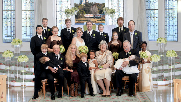 The whole Beach family gathers together for a family portrait in Disney's Wedding Pavilion. www.disneyweddings.com