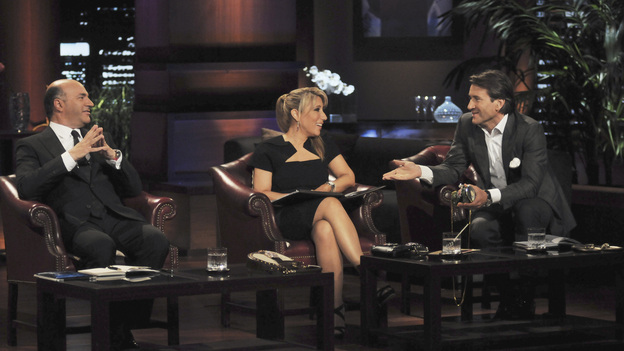 SHARK TANK - "Episode 304" - "Queen of QVC" Lori Greiner jumps into the Tank as a guest Shark and makes TV history when she does something no Shark before has ever done. Segments include a wife and mother from Ladera Ranch, CA hit hard by the recession, who makes an impassioned pitch of her unique towel design that provides coverage when changing out of a swimsuit in public places; a woman from Irvine, CA shows the Sharks her business idea -- a sweater and quilt invention called the "Swilt"; a wine connoisseur from Mason, OH shows a unique way to maximize the life of a beloved beverage; and a woman from Grove City, PA presents a natural and healthy cake mix - for dogs. In the biggest success story of "Shark Tank" to date, Sean Conway and DJ Stephan talk about the sale of their company, Notehall, an online marketplace where college students can buy and sell class notes, on "Shark Tank," FRIDAY, FEBRUARY 10 (8:00-9:00 p.m., ET) on the ABC Television Network. (ABC/MICHAEL ANSELL)KEVIN O'LEARY, LORI GREINER, ROBERT HERJAVEC