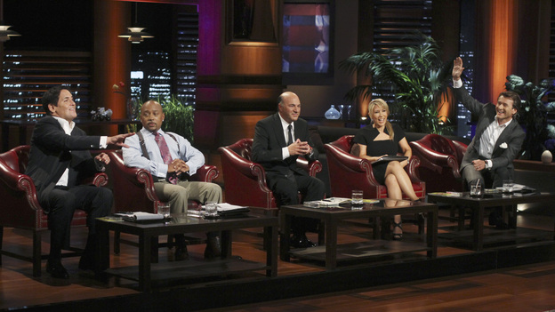 SHARK TANK - "Episode 303" - A family from Dallas, TX asks the Sharks to invest in their jewelry line business "for girls aged 8 to 80," created by one of the daughters when she was only 10 years old; a couple from Waldwich, NJ hopes the Sharks will agree to put a lid on their solution to replace missing garbage can lids; a single working mom from Wellington, FL pitches her wedge-type pillow that allows women with breast implants or large chests to comfortably sleep on their stomachs; and two gentlemen from Chicago, IL offer the Sharks a cup of couture with their reinvention of the tea experience. In a follow up story, George Podd from Lake Forest, IL shows how "Shark Tank" made the American dream come true for Lightfilm, a peel & stick light-up decal for car windows, on "Shark Tank," FRIDAY, FEBRUARY 17 (8:00-9:00 p.m., ET) on the ABC Television Network. (ABC/MICHAEL ANSELL)MARK CUBAN, DAYMOND JOHN, KEVIN O'LEARY, LORI GREINER, ROBERT HERJAVEC