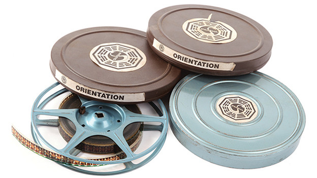 Set of three (3) DHARMA Initiative orientation films from the Swan stationSet of three (3) DHARMA Initiative orientation films with cans featuring DHARMA Swan station logo. The 16mm films are created for the occupants of the various stations throughout the Island, most of them featuring Pierre Chang under various aliases. They are first introduced when Jack, Locke and Kate enter the Swan station. After the confrontation with Desmond, they are directed to watch a short film narrated by a scientist named Dr. Marvin Candle. It is then that the Survivors initially learn about the existence of the DHARMA Initiative.