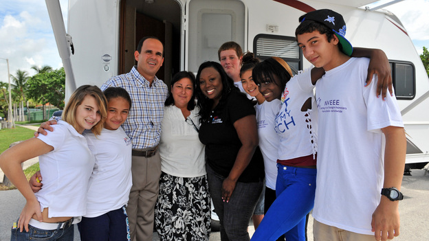 SECRET MILLIONAIRE - "Marcus Lemonis, Miami, FL" - CEO & Chairman of Camping World and Good Sam touches the lives of many when he returns to a very disadvantaged community of his Miami childhood hometown to secretly seek out those most in need. Over the course of seven days, this billion dollar business owner leaves his luxurious Chicago lifestyle and moves into a rundown trailer at welfare level wages. While there, he volunteers and gets to know some selfless heroes who are sacrificing their time, energy and money to provide a good home for young women at risk and to clothe children living in poverty. At week's end, Marcus gifts these amazing people with hundreds of thousands of dollars of his own money and confesses to having had "the single greatest experience of his life," on "Secret Millionaire," SUNDAY, AUGUST 5 (8:00-9:00 p.m., ET), on The ABC Television Network. (ABC/RODRIGO VARELA)MARCUS LEMONIS, JOWHARAH SANDERS, NVEEE KIDS
