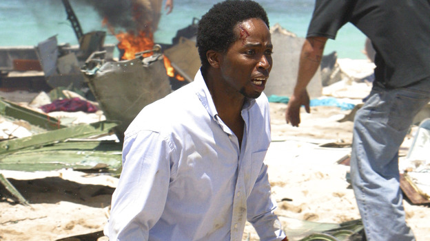 100440_8230 -- LOST - Out of the blackness the first thing Jack senses is pain. With a rush comes the horrible awareness that the plane he was on tore apart in mid-air and crashed on a Pacific island. From there it's a blur as his doctor's instinct kicks in: people need his help. Stripped of everything, the 48 survivors scavenge what they can from the plane for their survival. A few find inner strength they never knew they had. Like Kate who, with no medical training, suddenly finds herself suturing the doctor's wounds. The band of friends, family, enemies and strangers must work together against the cruel weather and harsh terrain. But the intense howls of the mysterious creatures stalking the jungle fill them all with fear. Fortunately, thanks to the calm leadership of quick-thinking Jack and level-headed Kate, they have hope.  But even heroes have secrets, as the survivors will come to learn. From J.J. Abrams, the creator of Alias, comes an action-packed adventure that will bring out the very best and the very worst in the people who are lost. (ABC/MARIO PEREZ) HARROLD PERRINEAU