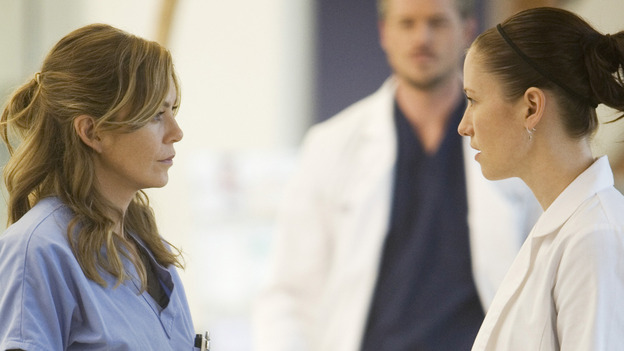 GREY'S ANATOMY - "These Ties That Bind" - Meredith and Lexie discuss a patient, on "Grey's Anatomy," THURSDAY, NOVEMBER 13 (9:00-10:01 p.m., ET) on the ABC Television Network. (ABC/RANDY HOLMES) ELLEN POMPEO, ERIC DANE (BACKGROUND), CHYLER LEIGH