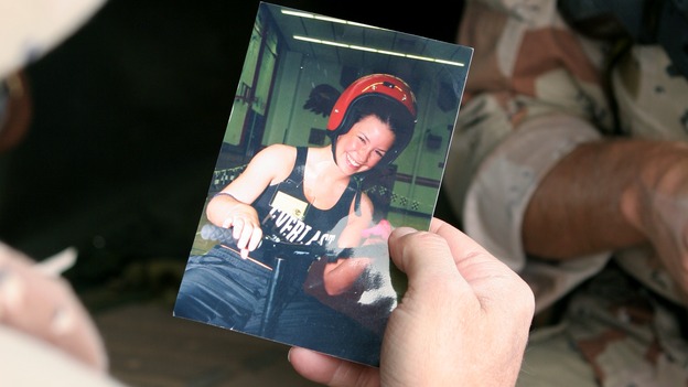 LOST - "One of Them" - During the first Gulf War, Sam Austen looks at a photo of his daughter, Kate, while transporting Sayid for questioning, on "Lost," WEDNESDAY, FEBRUARY 15 (9:00-10:03 p.m., ET), on the ABC Television Network. (ABC/MARIO PEREZ) LINDSEY GINTER HOLDS PHOTO OF EVANGELINE LILLY
