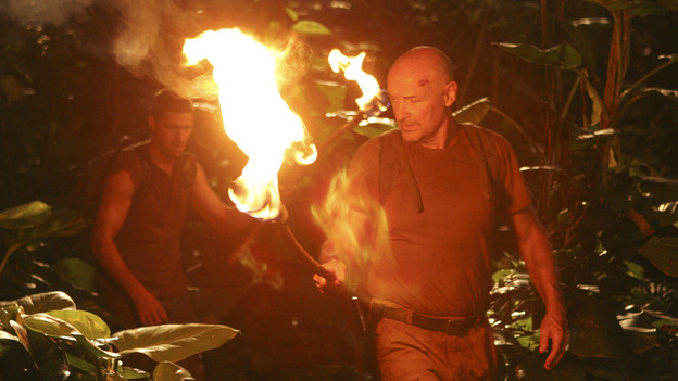 Them's Fightin' WordsMichael, once again, goes off on his own to find Walt. When Jack, Locke, Sawyer go after him, they are confronted by the bearded man who kidnapped Walt. The man tells them this is not their island. A defiant Jack challenges the man, who then produces a captured Kate. Dozens of torches light up the jungle to let Jack know that he is completely outnumbered. The survivors are allowed to return to the beach where Jack asks former cop Ana Lucia what it would take to form an army.