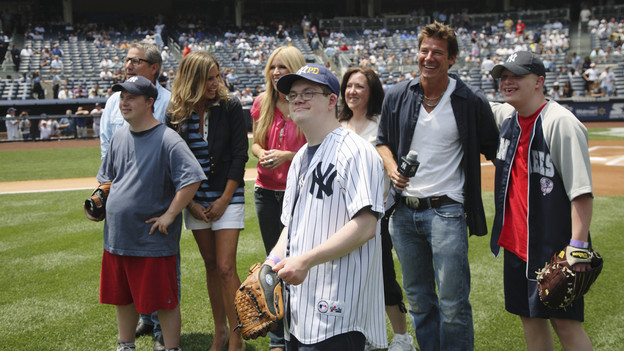 EXTREME MAKEOVER: HOME EDITION - ""Lutz Family" -- On June 20, "Extreme Makeover: Home Edition" gave a different kind of wake up call to the deserving Lutz family of East Setauket, New York. The family thought they had just been invited to attend an afternoon baseball game between the Yankees and the New York Mets. But imagine the family's surprise when, while surrounded by thousands of cheering fans at Yankee Stadium, they realized that they'd be the latest recipients of a new home. Instead of design team leader Ty Pennington's traditional morning wake up call, he stormed the field and announced the good news right before the game. This episode of "Extreme Makeover: Home Edition" airs SUNDAY, OCTOBER 3 (8:00-9:00 p.m., ET), on ABC." (ABC/ERIC LIEBOWITZ)DANNY LUTZ, PAUL DIMEO, TRACY HUTSON, PAIGE HEMMIS, WILLIAM LUTZ, KATHLEEN LUTZ, TY PENNINGTON, TIMMY LUTZ