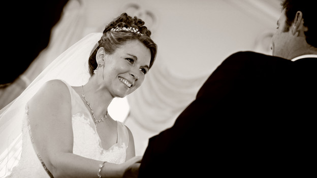 Melissa and Larry exchanging vows in Disney&acirc;��s Wedding Pavilion. www.disneyweddings.com