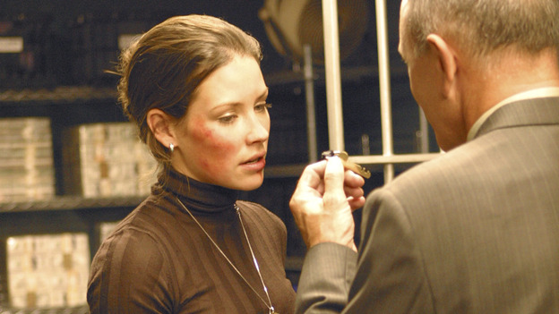 LOST - "Whatever the Case May Be" - Jack, Kate and Sawyer fight over possession of a newly discovered locked metal briefcase which might contain insights into Kate's mysterious past. Meanwhile, Sayid asks a reluctant Shannon to translate notes he took from the French woman, a rising tide threatens to engulf the fuselage and the entire beach encampment, and Rose and a grieving Charlie tentatively bond over Claire's baffling disappearance, on "Lost," WEDNESDAY, JANUARY 5 (8:00-9:00 p.m., ET), on the ABC Television Network.  (ABC/MARIO PEREZ) EVANGELINE LILLY, TIM HALLIGAN