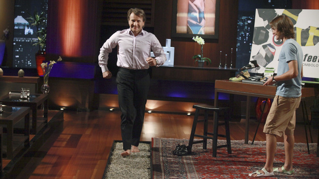 SHARK TANK - "Episode 309" - Indie-pop & singer-songwriter Ingrid Michaelson joins an entrepreneur from Marina del Rey, CA to pitch his high-tech music software product. A couple from Oldsmar, FL learns the hard way they have just one chance to convince the Sharks to invest in their instant solution for cellulite-free looking skin. Also: An entrepreneur from San Diego, CA pitches his unique sales distribution method for his stand-up paddle board company to the Sharks. A wine server from Fort Collins, CO has created an aerating device that could revolutionize the way wine is sold. Plus, there's a follow-up on Fullerton, CA's Rick Hopper and his invention, Readerest, a magnetic clip that secures eyeglasses -- and which Lori Greiner invested in during Season 3 -- on "Shark Tank," FRIDAY, MARCH 16 (8:00-9:00 p.m., ET) on the ABC Television Network. (ABC/RICHARD CARTWRIGHT)ROBERT HERJAVEC, JIMMY TOMCZAK (PAPER FEET)