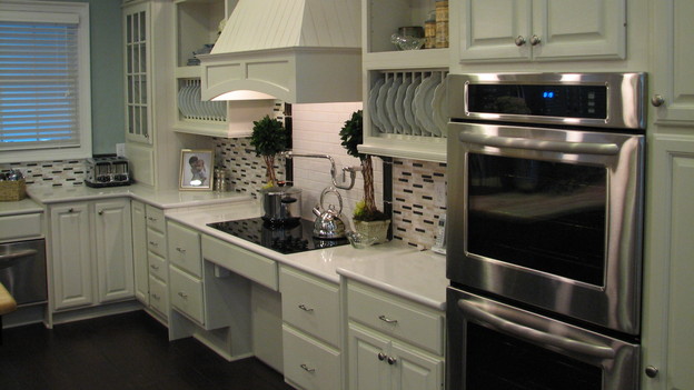 Silestone CountertopsWe have been using these beautiful and eco-friendly countertops in all of our homes this season.  Many of Silestone colors are made up of post consumer recycled glass, specifically the color "Dali," which is composed of more than 70% recycled glass.  In addition, the Stellar Series, Coffee Brown and Absolute Green contain 35% content.  Silestone also has the GREENGUARD Certification, an industry-independent, third-party testing program for low-emitting products and materials.  Therefore, because the countertops have low to no emissions of toxic chemicals, they contribute to better air quality inside your home.  