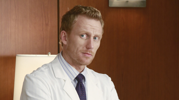 When Owen boards a plane, everyone thinks he's going to see Cristina. He's not. Owen flies to farm country to ask April to return to the hospital. She belongs in Seattle saving lives. Cristina later lets Owen know that they can't keep chatting like old times. She's in Minnesota now. That's where she needs to move forward. Owen hasn't been sleeping at all. That's why he opts to spend the night at Derek's trailer gazing up at the heavens. Perhaps he can take comfort in the fact that at least he's under the same starry sky as Cristina. Owen says the new head of cardio, Jeff Russell, pushed to get his wife back to Seattle. Cristina must act fast when Dr. Russell's post-op patient starts coughing up blood. Owen is ticked that she operated on someone else's patient. He thinks the new cardio guy may fire her. The opposite happens. Dr. Russell thanks Cristina for making a good save. He now knows why Owen pushed so hard to get her in there. And now Cristina knows the truth about how she got her job back. The hospital's lawyers are looking to make Owen the scapegoat for the plane crash that killed or injured his friends. He signed off on the switch to the airline that they used without knowing they had a history of mechanical problems. Owen realizes he's being manipulated by all parties as they are hoping a judge will throw out the case due to his conflict of interest regarding Cristina, who looks like she's going to muster up the courage to tell Owen she wants him back. This never happens. Before she can say anything, Owen lets her know that he thinks they should get a divorce. Owen lets Cristina know that the divorce papers are all ready. All they have to do is sign. Cristina is shocked when Mer spills the news that they have a better case regarding the lawsuit now that she's getting a divorce. This leads to some tense moments during a surgery with Owen. Afterwards, Cristina realizes that her husband blames himself for the plane crash. She lets him know that this wasn't his fault. She also lets him know that she wants him back. This leads to a passionate kiss. We'll see what happens next with these two.
